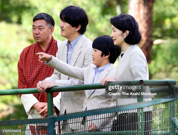 Crown Prince Fumihito, or Crown Prince Akishino, Crown Princess Kiko of Akishino and Prince Hisahito watch takins on August 20, 2019 in Thimphu,...