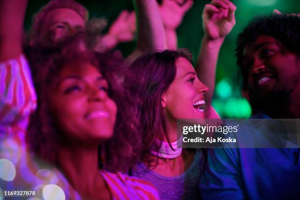 ecstatic fans at music festival. - live performance show stock pictures, royalty-free photos & images