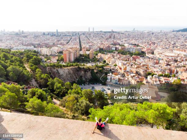 guy in the military bunkers viewpoint over barcelona city during sunrise. - montjuic stock pictures, royalty-free photos & images