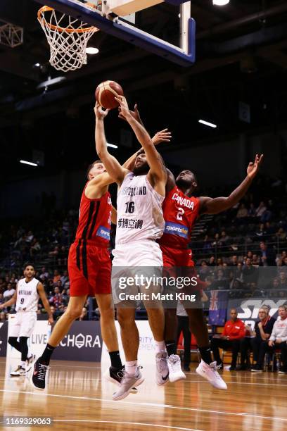 Tohi Smith-Milner of New Zealand is challenged by Kyle Wiltjer and Duane Notice of Canada during the International Basketball Friendly match between...