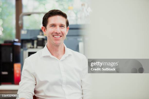 cheerful male biochemist - biochemist stock pictures, royalty-free photos & images