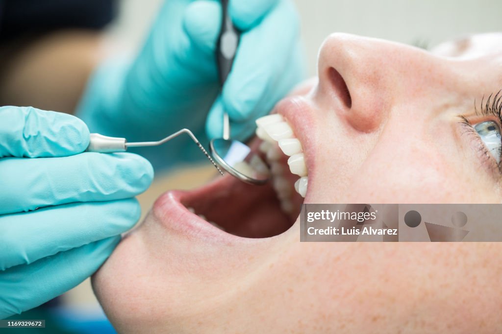 Woman getting a dental check-up at dentistry