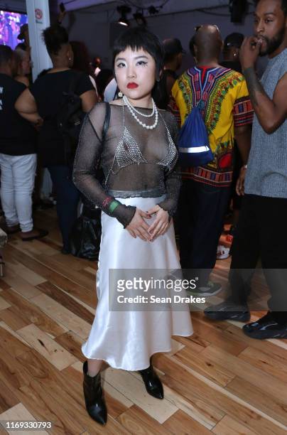 Kennie Zhou of Beijing China, wears a shimmery shear pull-over with a rhinestone bra, during the POSE Season 2 Finale Viewing and Mini-Ball presented...