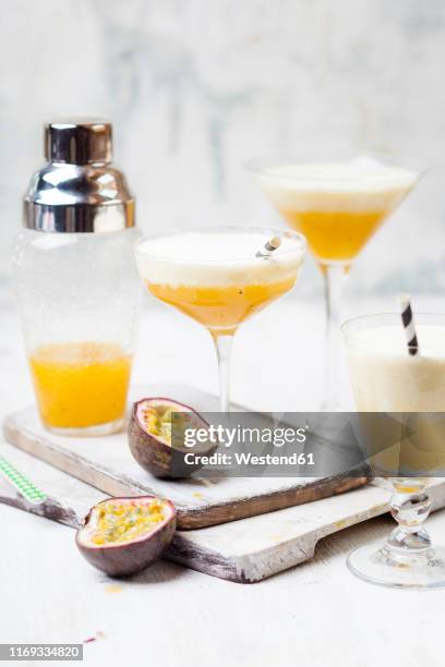 creamy summer fruit cocktail with passion fruit juice, orange juice, lemon juice, pineapple juice, vanilla, cream - passion fruit imagens e fotografias de stock