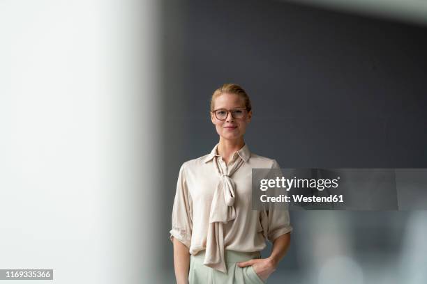 portrait of confident young businesswoman - beige blouse stock pictures, royalty-free photos & images