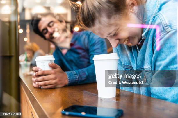 friends having fun together in a coffee shop - coffe to go stockfoto's en -beelden