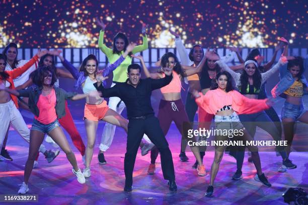 Bollywood actor Salman Khan performs on stage during the 20th International Indian Film Academy Awards at NSCI Dome in Mumbai early on September 19,...