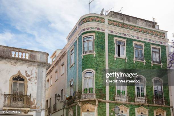 house with green ceramic tiles, lagos, algarve, portugal - portugal tiles stockfoto's en -beelden