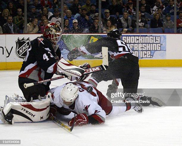 Carolina Hurricanes' Erik Cole is awarded a penalty shot after being taken down by Buffalos' Jochen Hecht during a game against the Buffalo Sabres at...