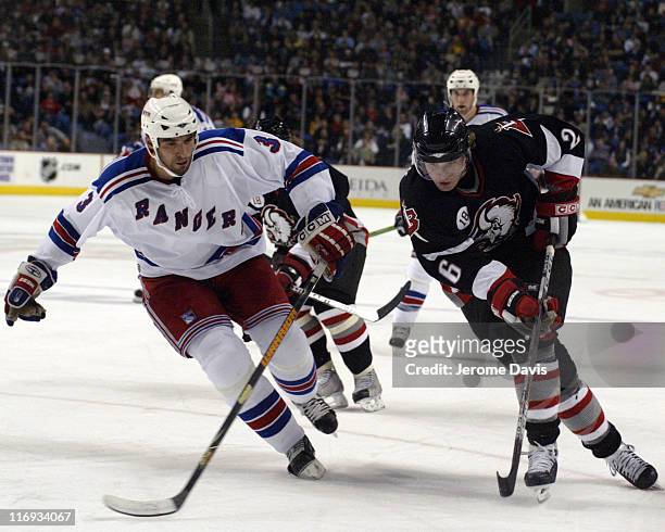 Buffalo Sabres' Thomas Vanek tries to go around Rangers Michal Rozsival during a game against the New York Rangers at the HSBC Arena in Buffalo, NY,...