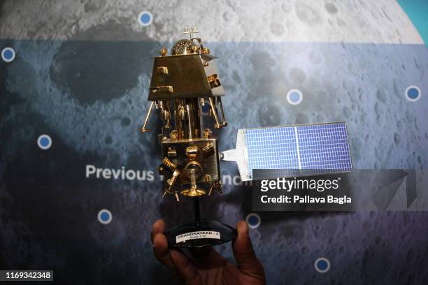 Scale model of one of the Indian Moon Mission crafts is displayed at a press meet on August 20, 2019 in Bengaluru, India. India is headed to the...