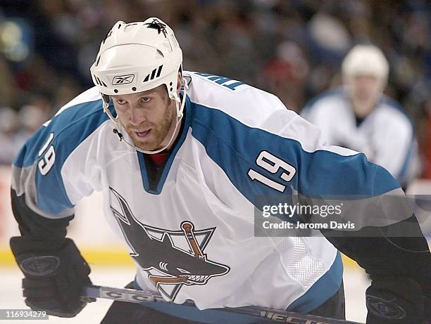 San Jose Sharks' Joe Thornton, who was recently acquired in a trade with the Boston Bruins, waits for the puck to drop versus the Buffalo Sabres at...