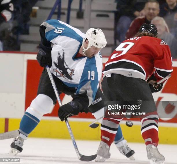 San Jose Sharks' Joe Thornton fights for the puck versus the Buffalo Sabres at the HSBC Arena in Buffalo, NY, December 02, 2005. San Jose defeated...