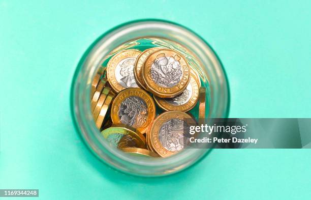 Photo illustration shows,British currency coins savings in jar, shot from above on August 19,2019 in London,England.