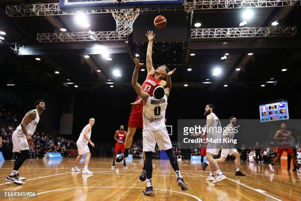 Kyle Wiltjer drives to the basket under pressure from Tai Webster of New Zealand during the International Basketball Friendly match between Canada...