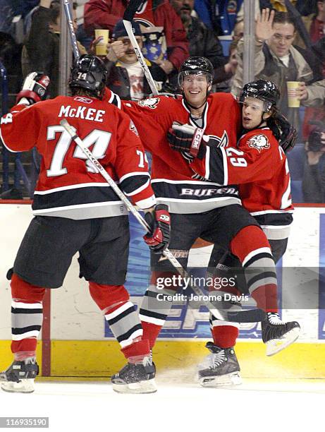 Buffalo Sabres' Jay McKee, Thomas Vanek , and Jason Pominville celebrate after a goal by Thomas Vanek during the game versus the Florida Panthers at...