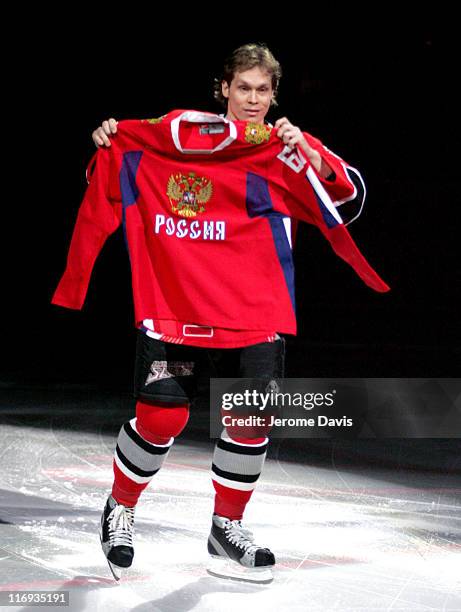 Buffalo Sabres' Olympian for team Russia ,Maxim Afinogenov, shows his team Russia Jersey before a pre-game ceremony during the game versus the...