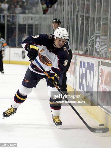 Atlanta Thrashers' Marc Savard shoots the puck into the zone during a game versus the Buffalo Sabres at the HSBC Arena in Buffalo, NY, March 1, 2006....