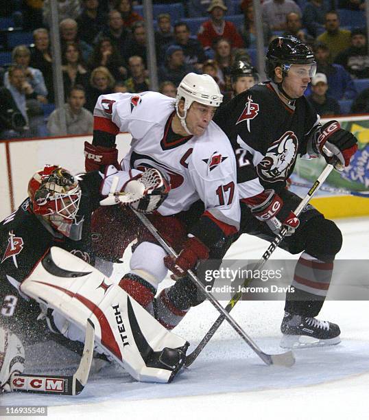 Buffalo Sabres' goalie Martin Biron and Carolina Hurricanes' Rod Brind'amour in action during a game against the Carolina Hurricanes at the HSBC...