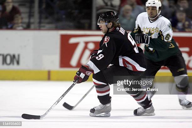 Buffalo Sabres' Derek Roy skates away from Trevor Daley during a game versus the Dallas Stars at the HSBC Arena in Buffalo, NY, December 14, 2005.