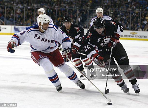 New York Rangers' Michal Rozsival and Buffalo Sabres' Thomas Vanek during a game against the Buffalo Sabres at the HSBC Arena in Buffalo, NY,...