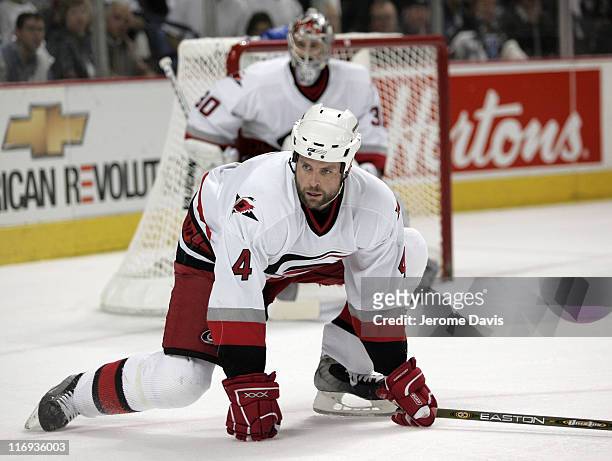 Aaron Ward of the Carolina Hurricanes gets down to defend his net during game 3 of the Eastern Conference Finals versus the Buffalo Sabres at the...