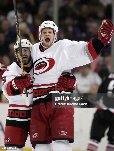 Eric Staal and Mark Recchi celebrate the Carolina Hurricanes celebrate their second goal of the first period first during game 4 of the Eastern...