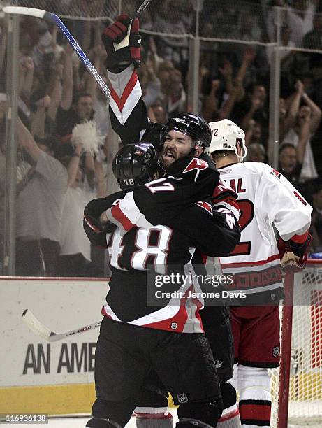 Dumont of the Buffalo Sabres celebrates his first period goal with teammate Daniel Briere during game 6 of the Eastern Conference Finals versus the...