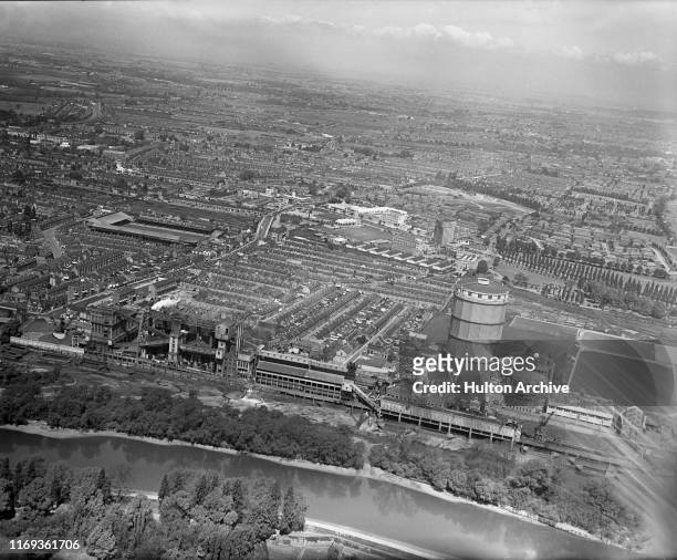 Aerial view of the River Thames at Brentford with Brentford Gas Works in foreground and the Great West Road and Griffin Park Stadium, home of...