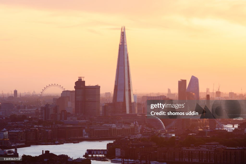 Aerial view over London city against sky at sunset