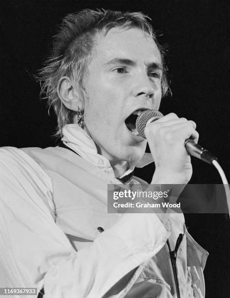 English singer Johnny Rotten of punk rock band The Sex Pistols performs live on stage at Leeds Polytechnic during their 'Anarchy Tour', Leeds, UK,...