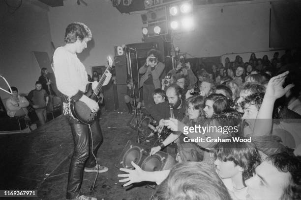 English guitarist Steve Jones of punk rock band The Sex Pistols performs live on stage at Leeds Polytechnic during their 'Anarchy Tour', Leeds, UK,...