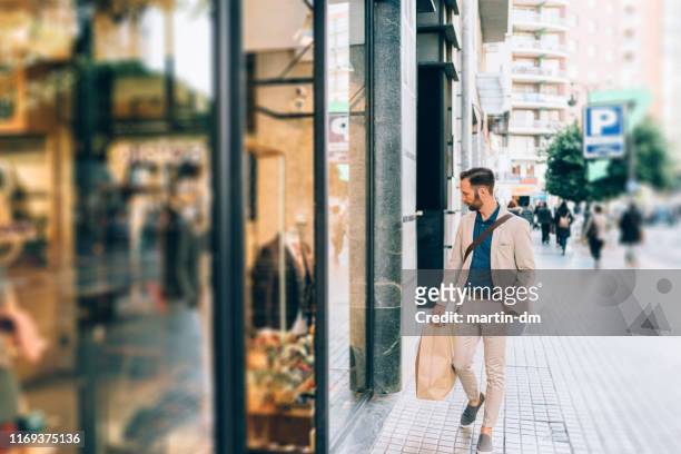 businessman shopping in valencia - retail place stock pictures, royalty-free photos & images