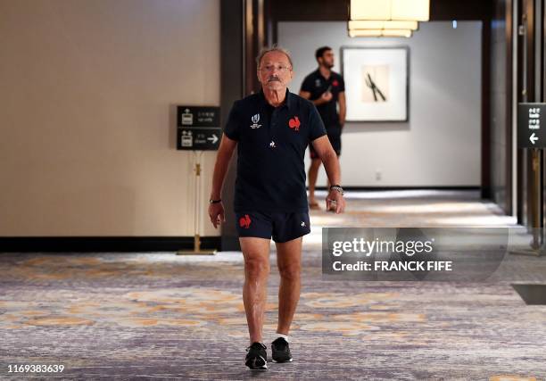 France's head coach Jacques Brunel arrives for a press conference at a hotel in Tokyo on September 19 to announce his squad for their first match...