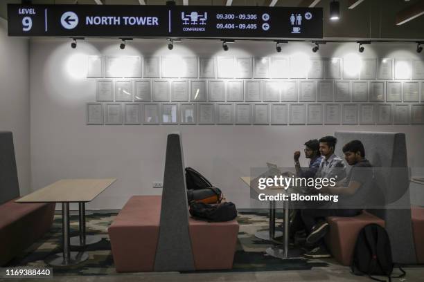 Employees use laptop computers in a collaborative work area at the Amazon.com Inc. Office campus in Hyderabad, India, on Friday, Sept. 6, 2019....