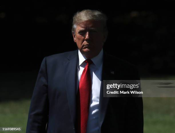 President Donald Trump walks up to speak to the media before departing from the White House on August 21, 2019 in Washington, DC. President Trump...