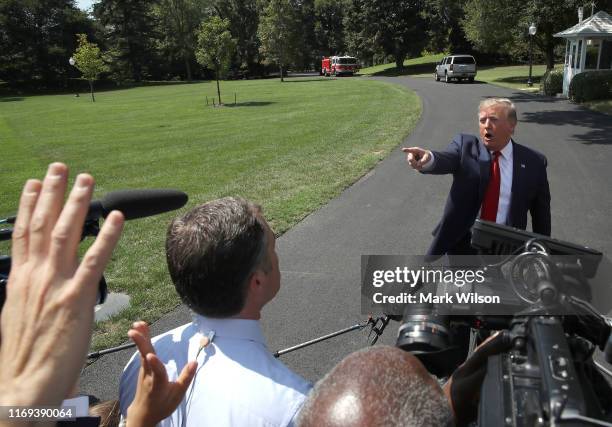 President Donald Trump speaks to the media before departing from the White House on August 21, 2019 in Washington, DC. President Trump spoke on...