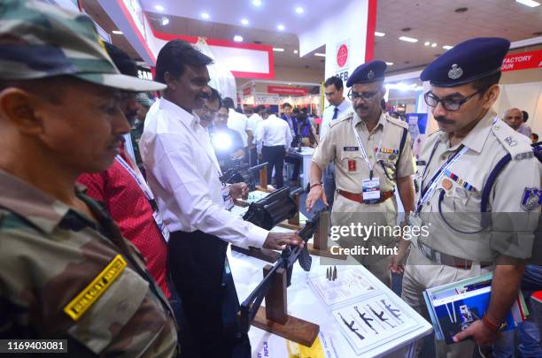 Ordnance factory guns are being shown and explained to Police officials at the Police Expo, at Pragati Maidan in Delhi.