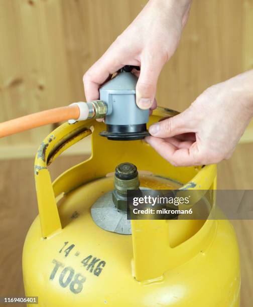 lpg gas bottle, butane gas cylinders - lpg-installation stock pictures, royalty-free photos & images