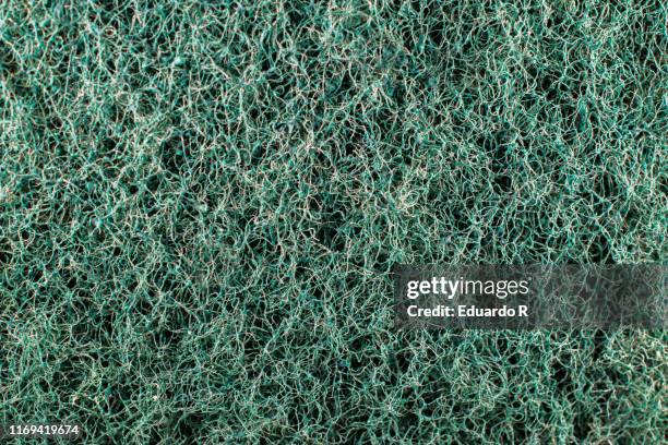 rough texture of green scourer - poroso foto e immagini stock