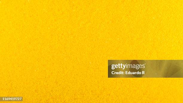 rough texture of yellow sponge with holes - cleaning sponge stock pictures, royalty-free photos & images