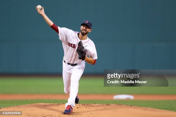 Starting pitches Rick Porcello of the Boston Red Sox throws to a Philadelphia Phillies batter during the first inning at Fenway Park on August 21,...
