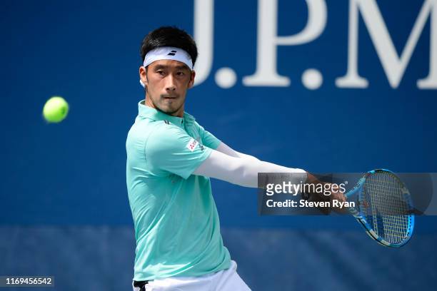 Yuichi Sugita of Japan returns a shot during his men's singles second round match against Jenson Brooksby of the United States on Day Three of the...