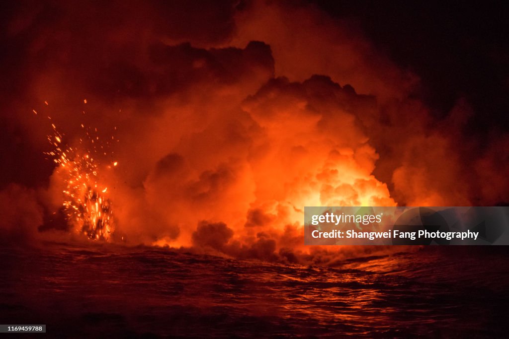 Lava splash into the Pacific Ocean