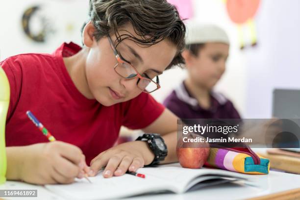 kids during class in classroom - two young arabic children only indoor portrait stock pictures, royalty-free photos & images