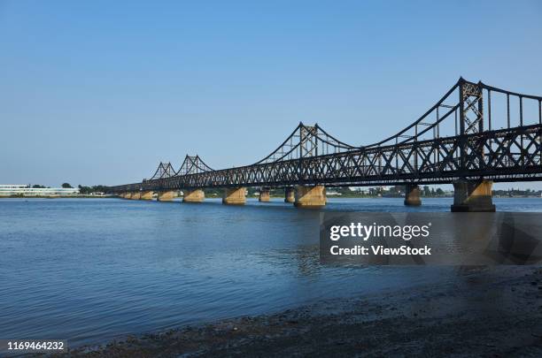 dandong yalu river bridge - liaoning province stock pictures, royalty-free photos & images