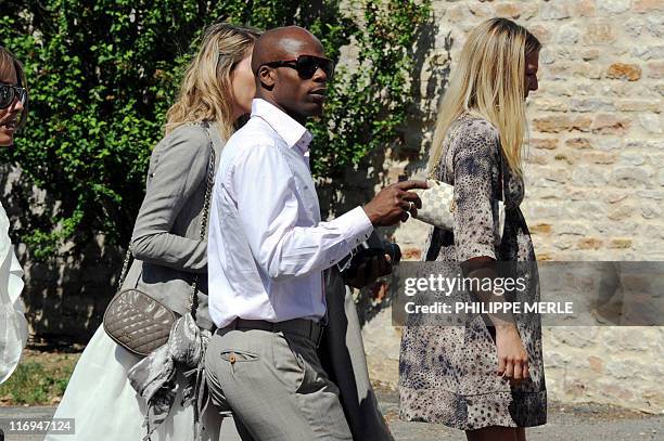 French football player Sylvain Wiltord arrives to attend the wedding of French football player Sidney Govou and Clemence Catherin on June 18, 2011 in...