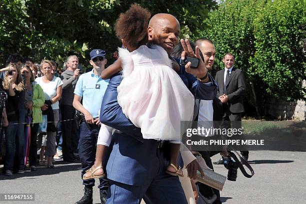 French football player Jean-Alain Boumsong arrives to attend the wedding of French football player Sidney Govou and Clemence Catherin on June 18,...