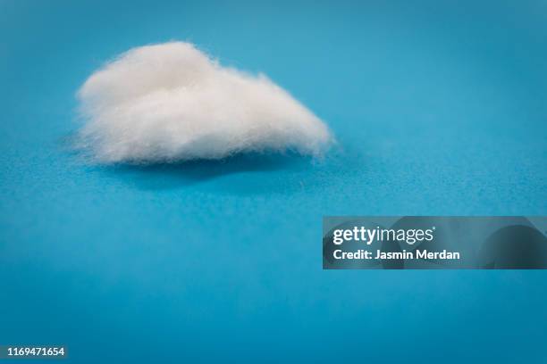 white cotton clouds on blue background - cotton cloud stock pictures, royalty-free photos & images