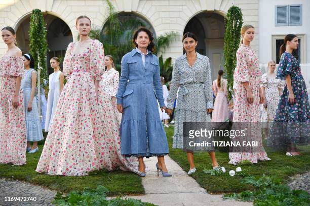 Italian fashion designer Luisa Beccaria poses among models during the presentation of her Women's Spring Summer 2020 collection in Milan on September...